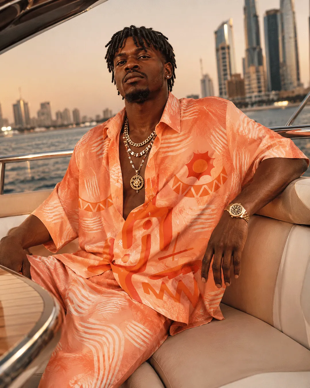 Orange artwork pattern applied to relaxed menswear