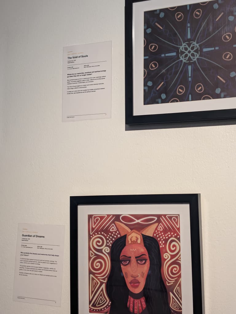 Framed exhibition works shown with their interpretation labels