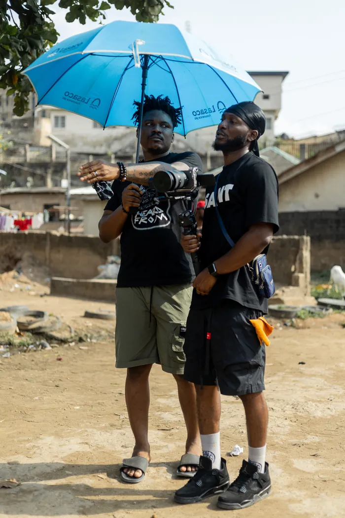 Thomas Ogun directing with the camera team on location in Nigeria