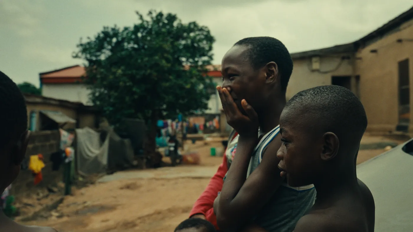 Children observing the production in a Lagos neighbourhood
