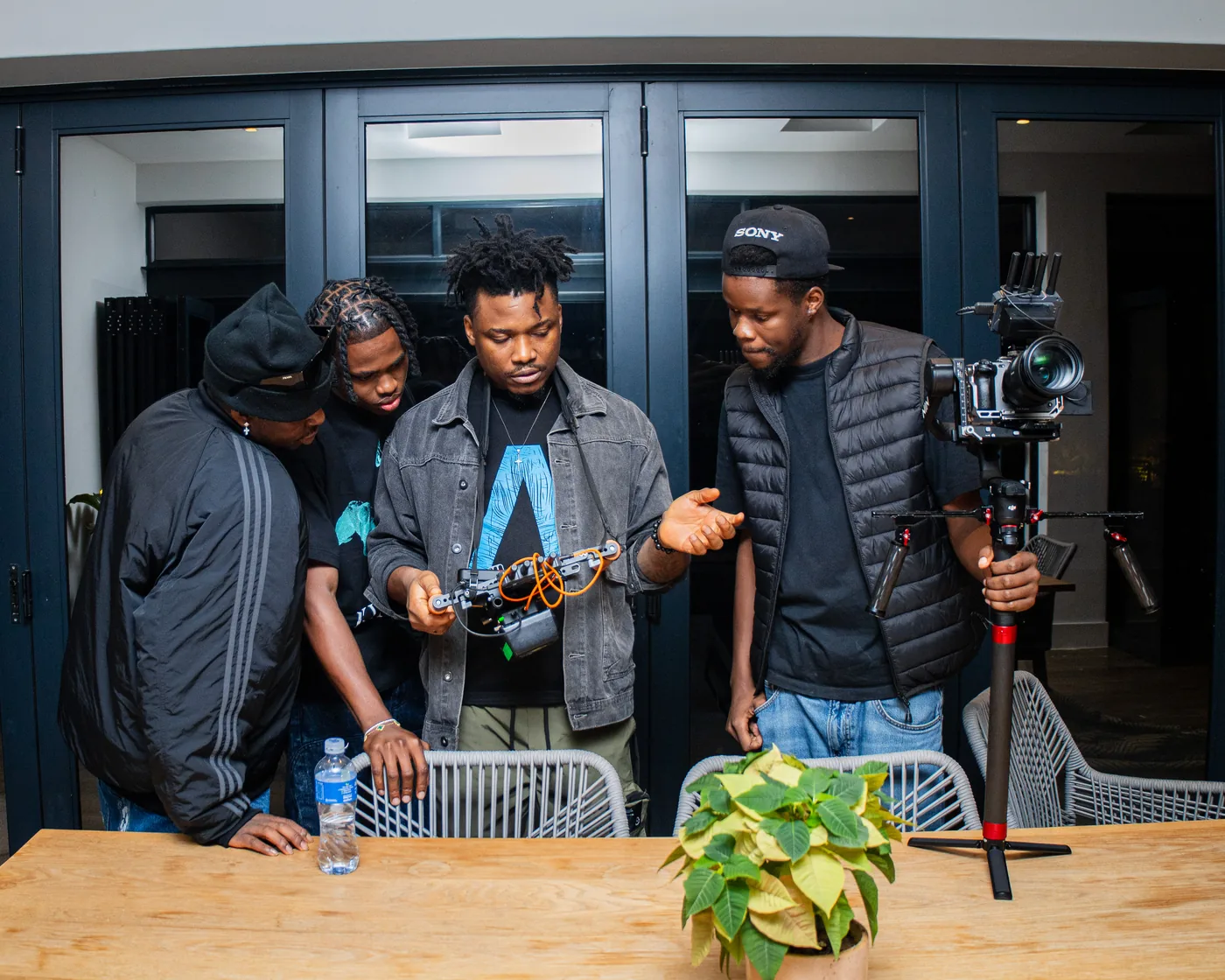Thomas Ogun reviewing a camera setup with the production team