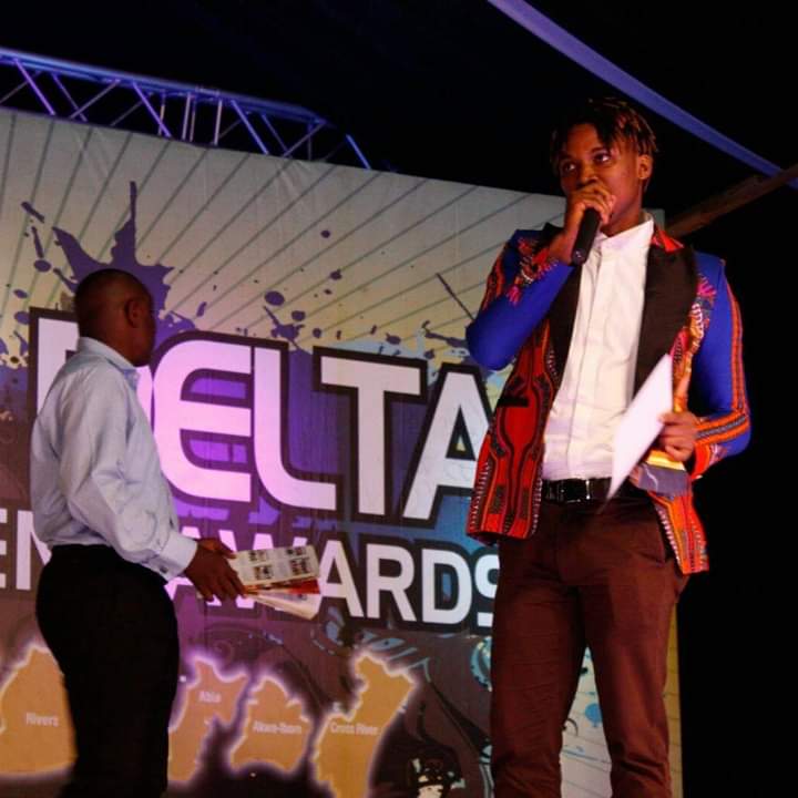Thomas Ogun speaking at an awards event