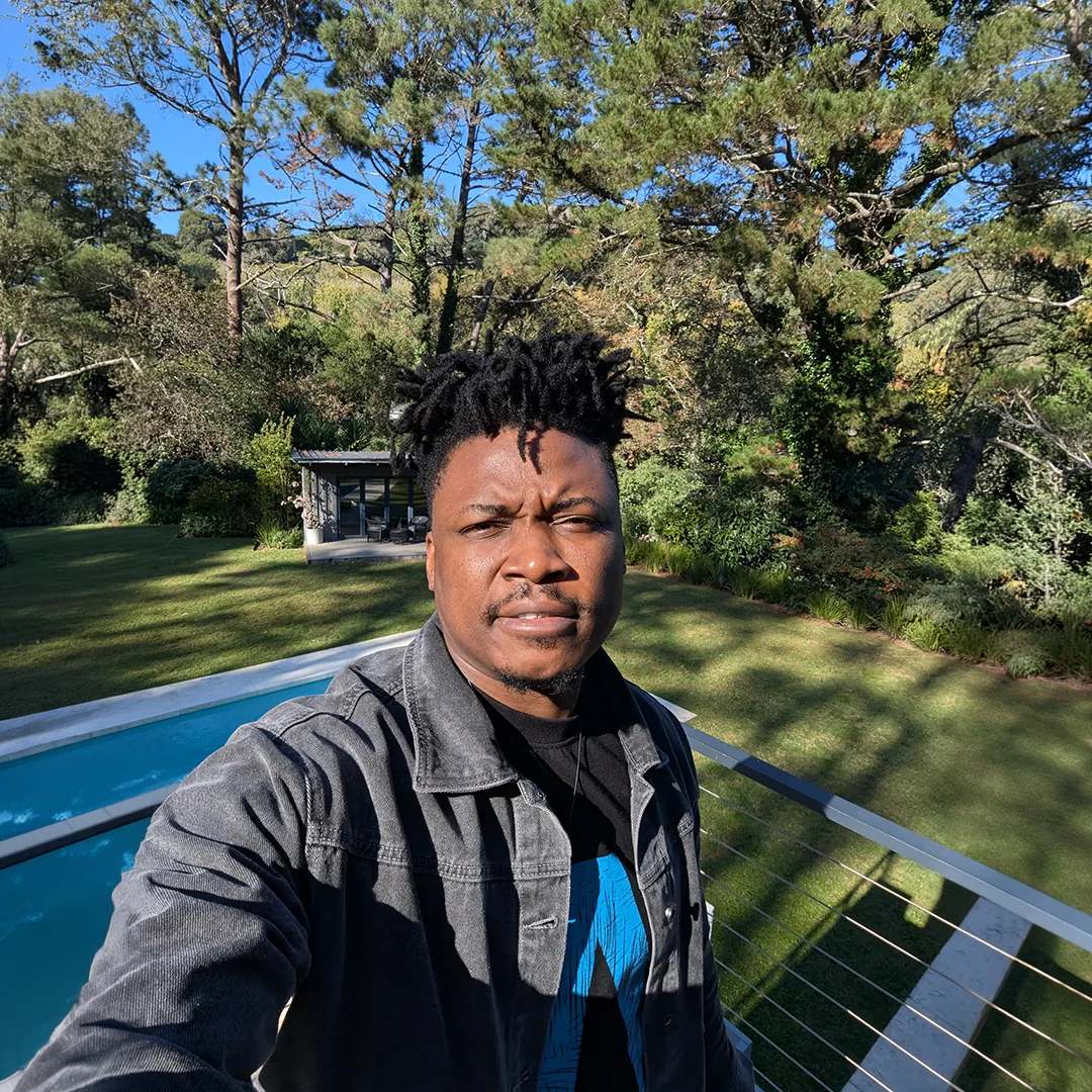 Thomas Ogun outdoors in a garden setting