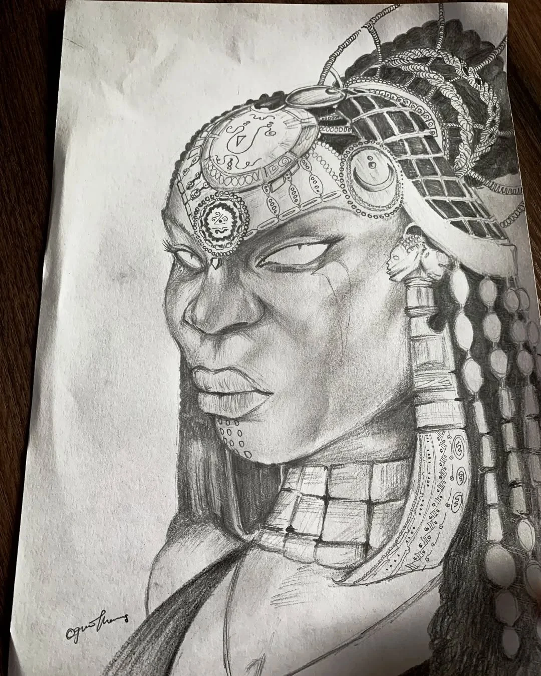 Graphite portrait of a decorated figure in profile