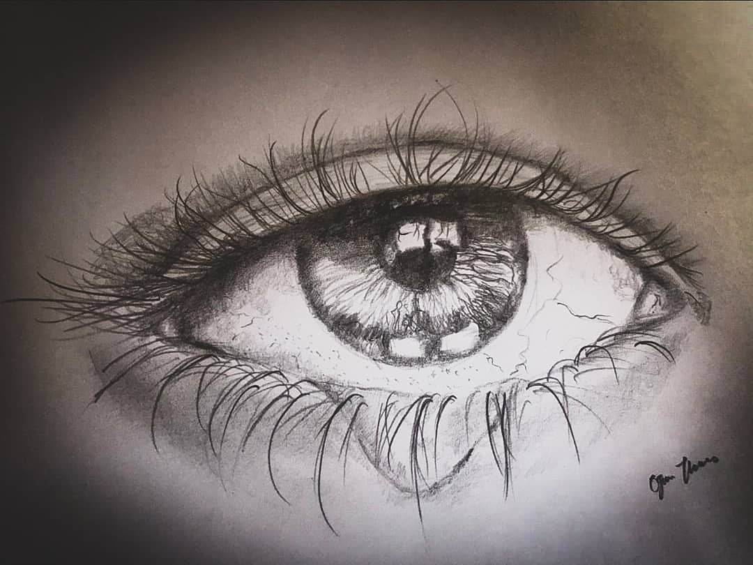 Detailed graphite drawing of a human eye by Thomas Ogun